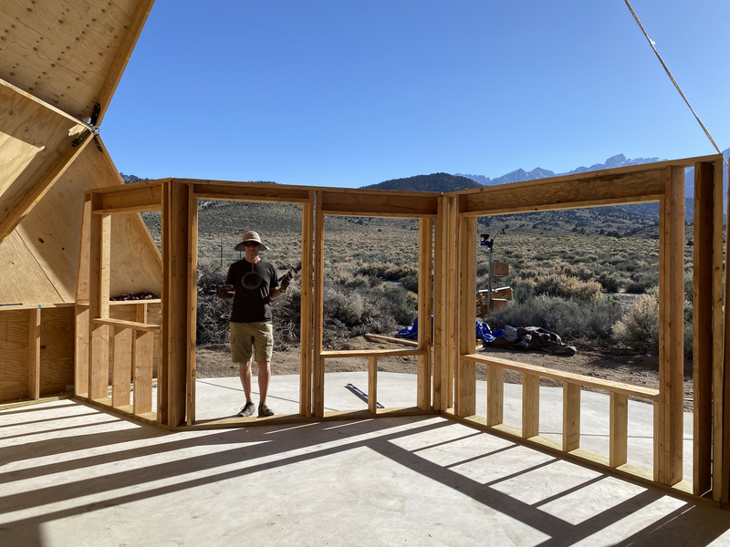 A man standing in a framed doorway