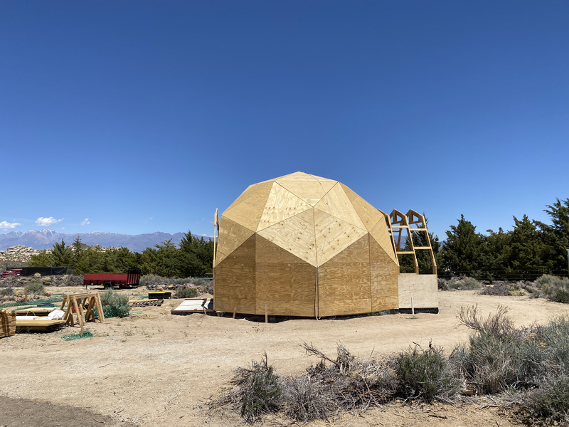 2 arches attached to one side of a geodesic dome; 1 arch attached to the other