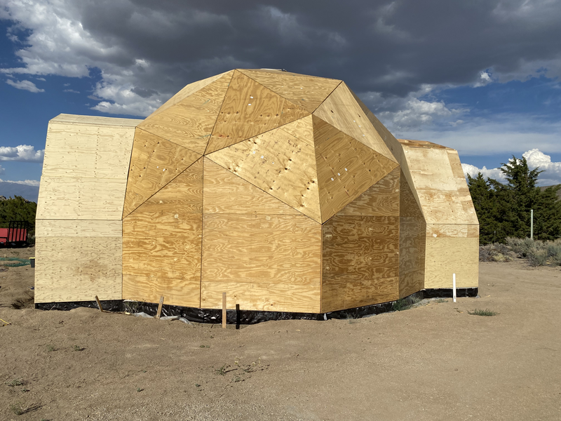 A geodesic dome with 2 extensions at 180 degrees